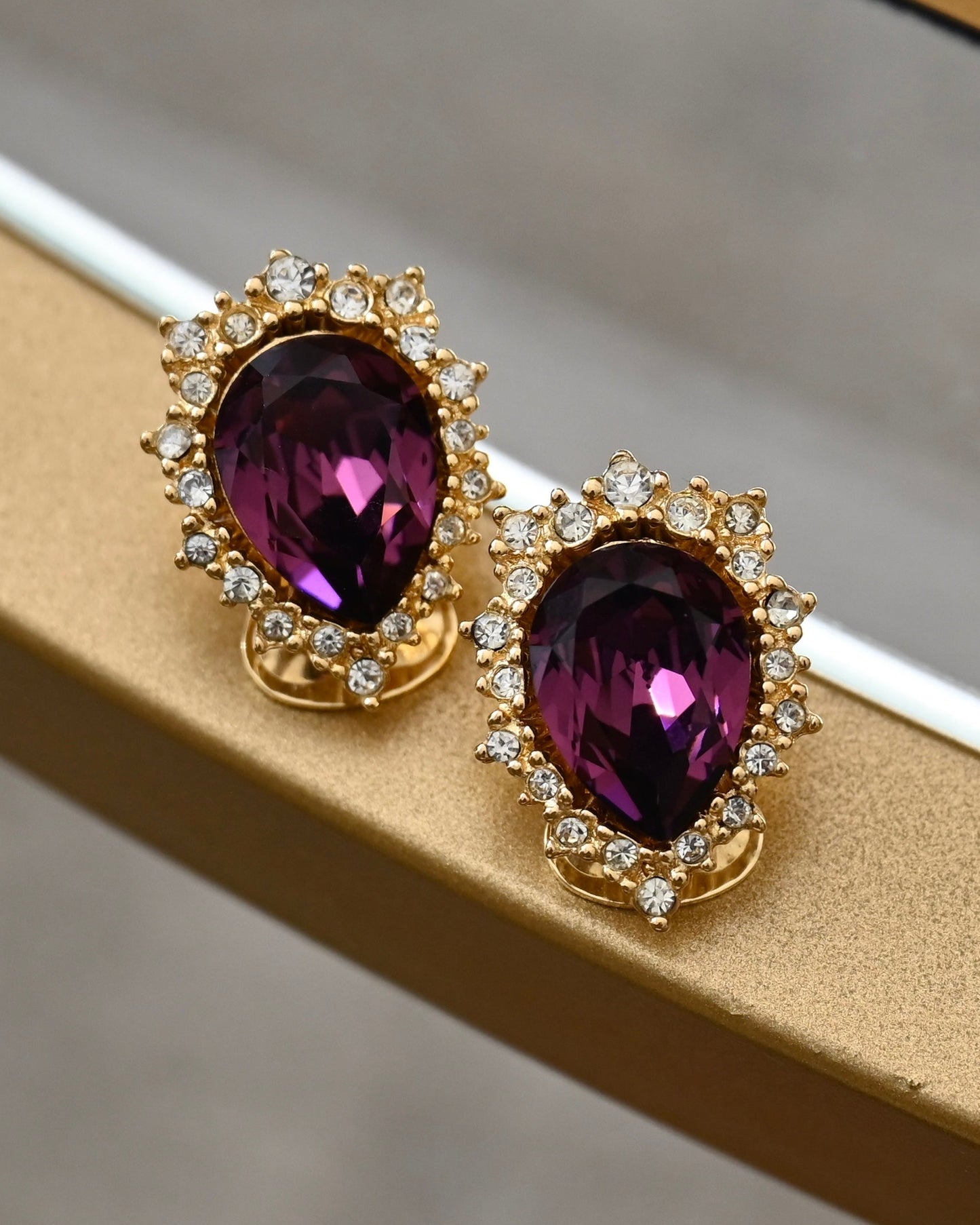 Vintage Christian Dior "Starburst" Collection Teardrop Purple Rhinestone Gold-Tone Clip-On Earrings
