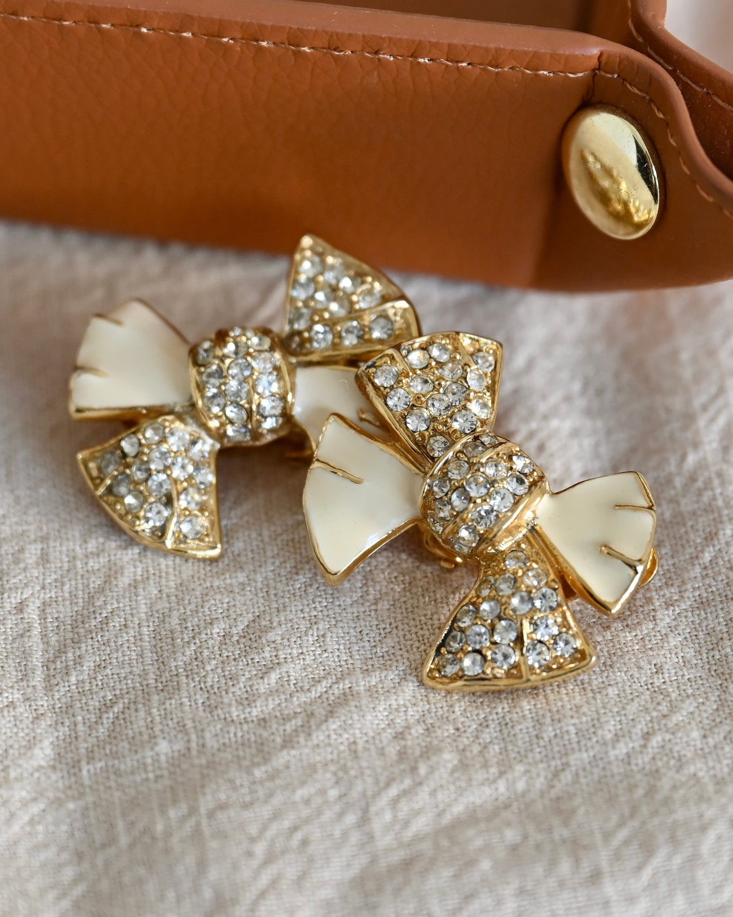 Vintage Givenchy Bow Tie Butterfly Knot White Enamel Rhinestone Pavé Gold-Tone Clip-on Earrings